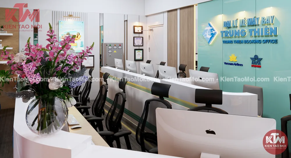 Góc tư vấn khách hàng văn phòng đại lý vé máy bay, ghế lưới đen và hoa tươi