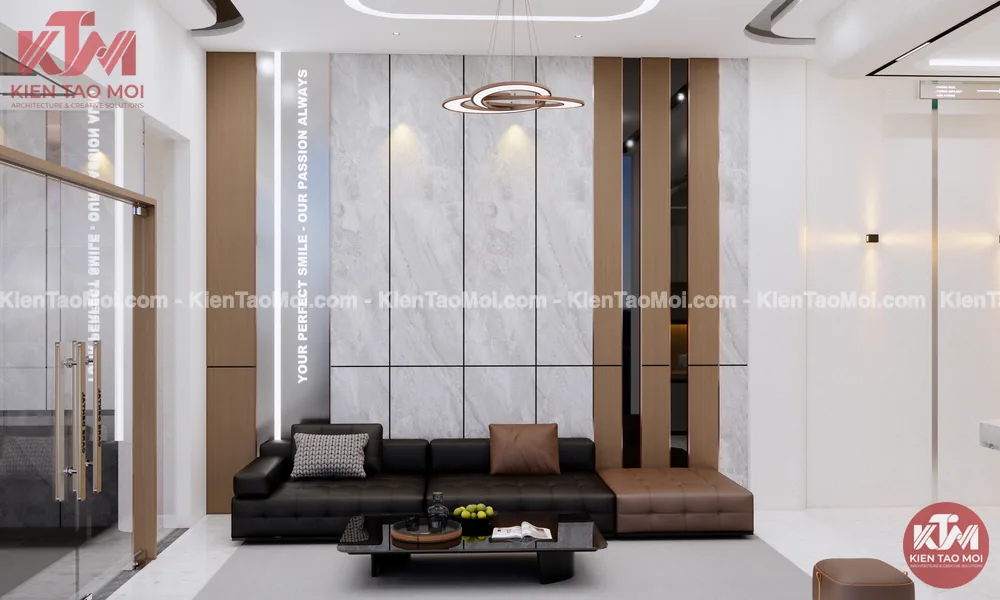 Phòng chờ trong thiết kế phòng khám nha khoa, sofa da đen và tường đá trắng