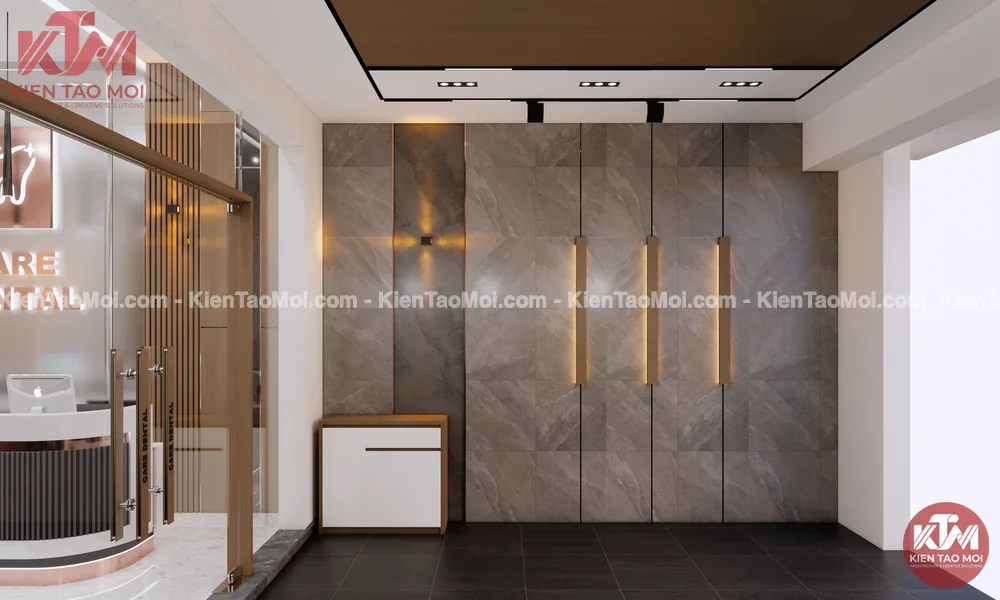 Tường trang trí nội thất nha khoa ốp đá xám, thanh đèn LED vàng